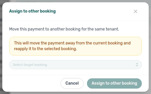 Booking detail Transactions tab — Assign to other booking modal with target booking selector